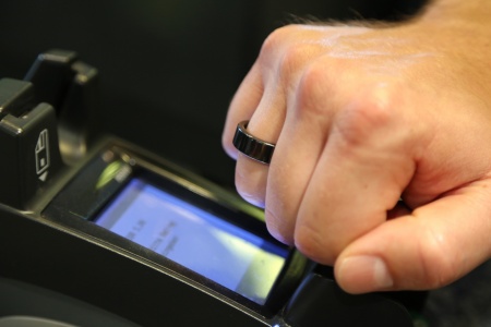 The world's first EMVCo compliant payment ring is based on a contactless security chip from Infineon Technologies AG. The tiny, water-proof smart wearable works like a contactless payment card. Users can pay by simply holding their finger with the ring closely to any EMVCo contactless-enabled payment terminal.